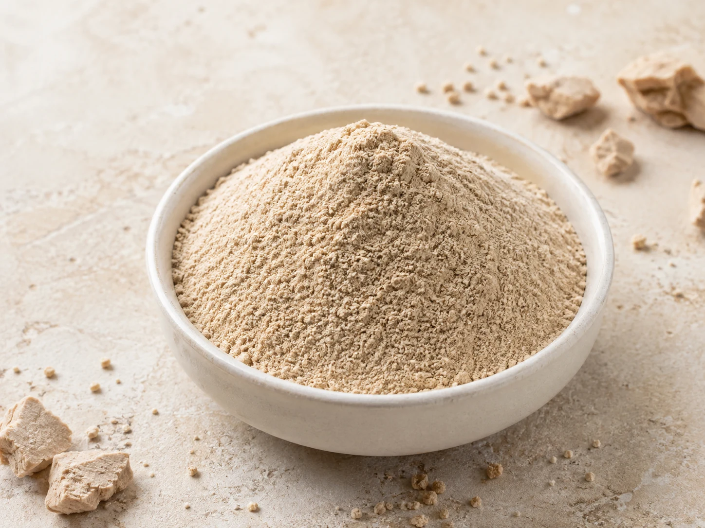 Beige yeast-derived ingredient powder presented in a ceramic bowl